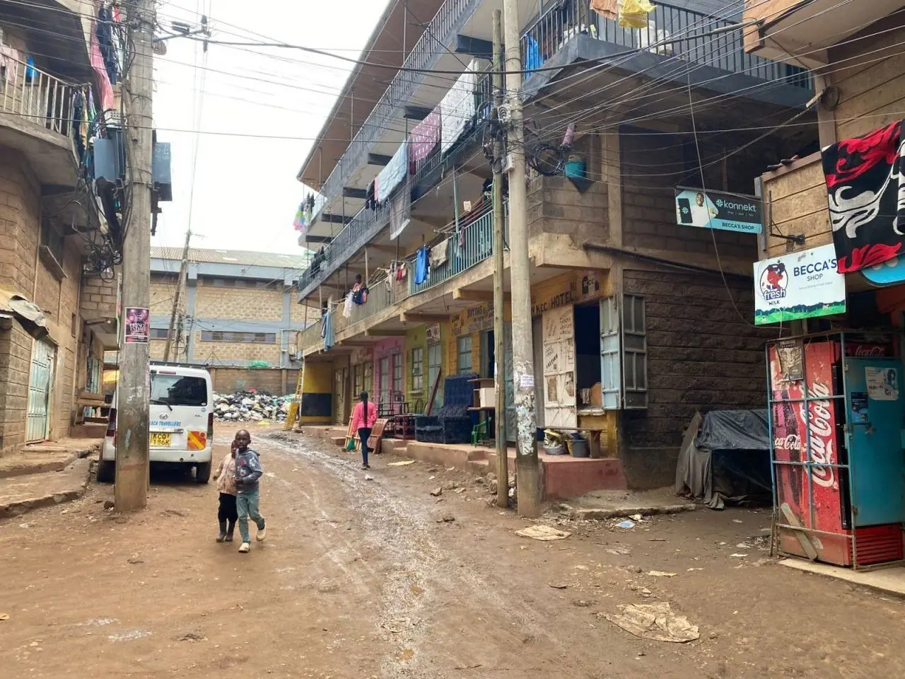 A Baba Dogo street lined with apartment blocks and shops
